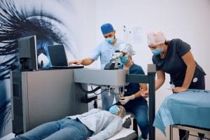 female patient undergoing a laser eye surgery at ophthalmology clinic.